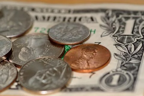 Selective focus close up of us banknotes and coins Stock Photos