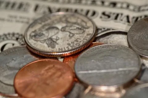 Selective focus close up of us banknotes and coins Stock Photos