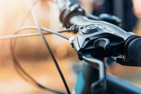 Selective focus Close-up view of a bicycle handlebar and brake lever, showc.. Stock Photos