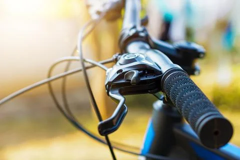 Selective focus Close-up view of a bicycle handlebar and brake lever, showc.. Stock Photos