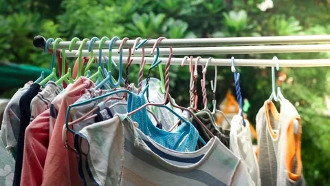 Selective focus of clothes hanging on the clothesline Stock Footage 156402458