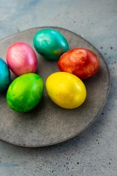 Selective focus, colored chicken eggs with food dye Stock Photos