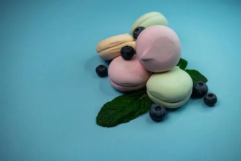 Selective focus, colored fruit marshmallow with blueberry berries Stock Photos