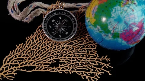 Selective focus of compass, world globe and decoration item. Video stock 118900944