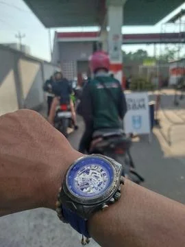 Selective focus. Concept and idea wristwatch at the gas station. 스톡 사진