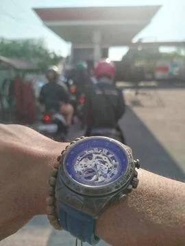 Selective focus. Concept and idea wristwatch at the gas station. 스톡 사진