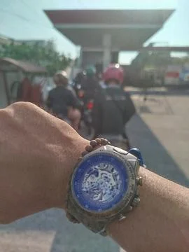 Selective focus. Concept and idea wristwatch at the gas station. Photos