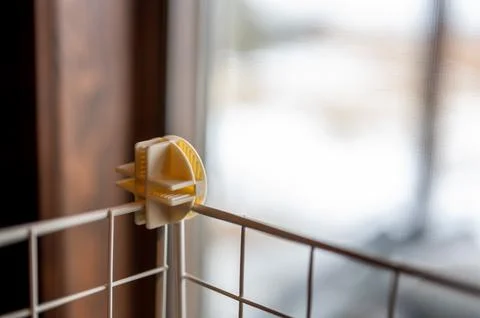 Selective focus on a connecting block on a modular wire cage shelving system Stock Photos