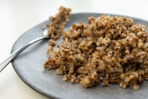 Selective focus, cooked buckwheat on a plate Stock Photos