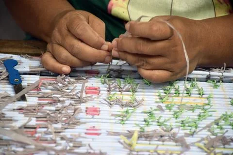 Selective focus of a craftsman making a typical weaving craft Stock Photos