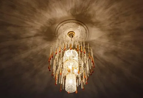 Selective focus of Crystal Chandelier , ceiling lights, black shadows Stock Photos