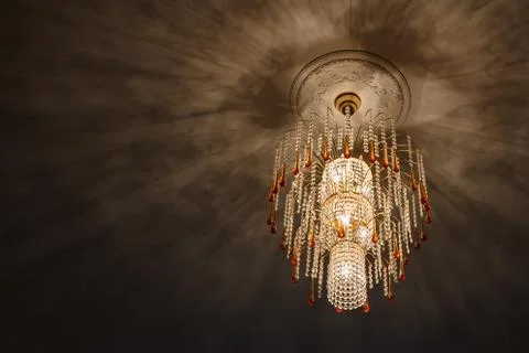 Selective focus of Crystal Chandelier , ceiling lights, black shadows Stock Photos