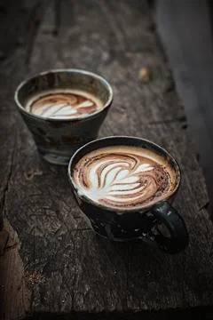 Selective focus cup of hot latte art coffee Stock Photos