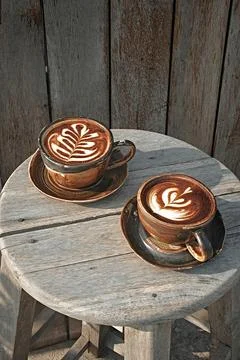 Selective focus cup of hot latte art coffee Stock Photos