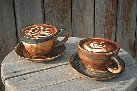 Selective focus cup of hot latte art coffee Stock Photos