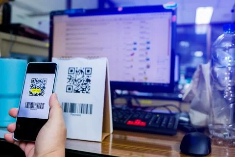 Selective focus to customer hand holding smart phone to scan Qr code payment  Stock Photos