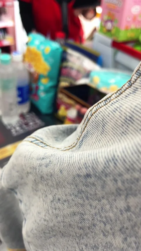 Selective Focus Of A Customer Holding A Smartphone At A Supermarket Checkout Stock-Footage 346542836