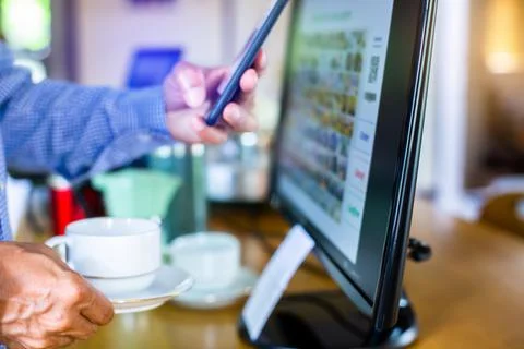 Selective focus to customer scan QR code to payment and printing receipt at c Stock Photos