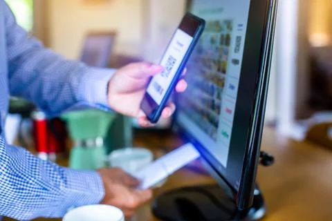 Selective focus to customer scan QR code to payment and printing receipt at c Stock Photos