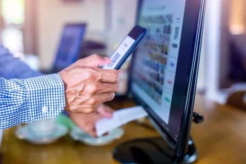 Selective focus to customer scan QR code to payment and printing receipt at c Stock Photos