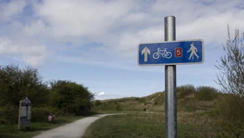 Selective focus of cycle path footpath directional sign Stock Photos