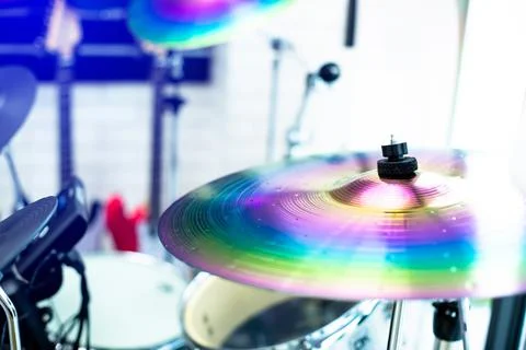 Selective focus to cymbals of drum set in music room. Stock Photos