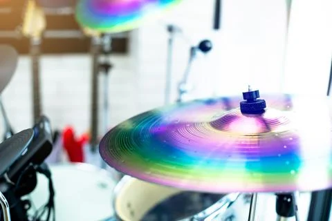 Selective focus to cymbals of drum set in music room. Stock Photos
