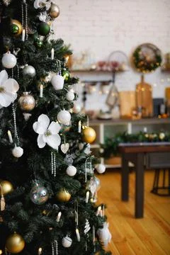Selective focus. Decorated Christmas tree with toys and gifts and garland lig Stock Photos