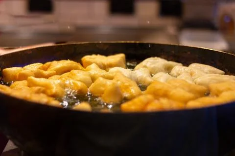 Selective focus deep fried dough stick in big pan, Thai street food 스톡 사진
