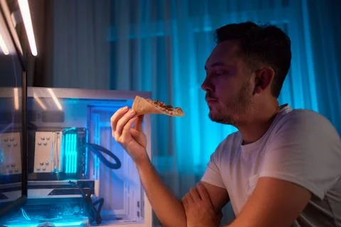Selective focus on delicious pizza cheerful man is taking from the box. Program 스톡 사진