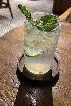 Selective focus, Delicious refreshing summer mojito with ice, lime and mint i Stock Photos