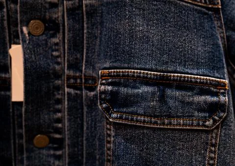 Selective focus on denim jean jacket pocket in clothes shop. Denim jacket poc Foto stock