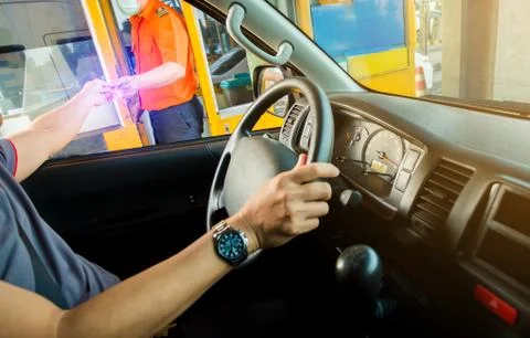 Selective focus to driver pay for the expressway Stockfoto's