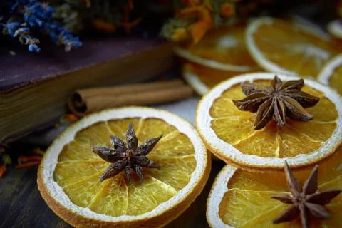 Selective focus on dry oranges with star anise on the top. Soft focus backgro Stock Photos