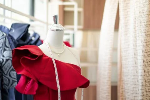 Selective focus of dummy mannequin with measuring tape in tailors studio. Con Stock Photos