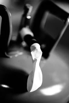 Selective focus on edge of an inflatable balloon attached to a helium canister. Stock Photos