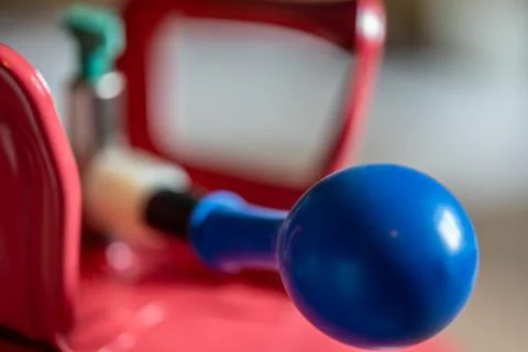 Selective focus on edge of an inflatable balloon attached to a helium canister. Stock Photos
