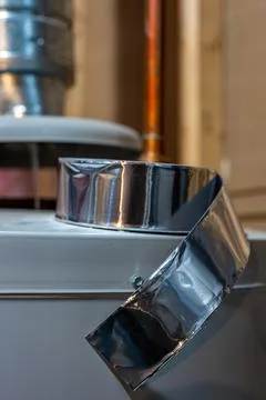 Selective focus on the edge of a roll of metallic aluminum foil HVAC duct tape Stock Photos