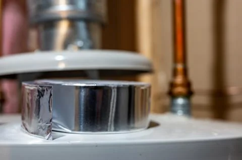 Selective focus on the edge of a roll of metallic aluminum foil HVAC duct tape Stock Photos