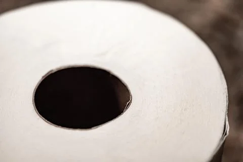 Selective focus on the edge sheet of a roll of toilet paper where individual Stock Photos