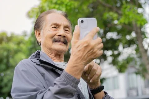 Selective focus. of an elderly retired man is walking exercise or workout a.. Stock Photos