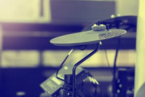 Selective focus to electronic cymbals of electronic drum set in music room. Stock Photos