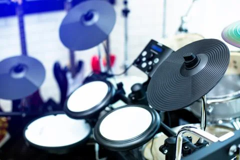 Selective focus to electronic cymbals of electronic drum set in music room. 写真素材