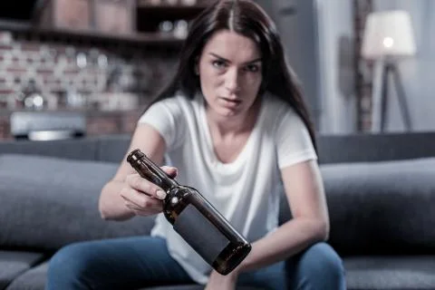 Selective focus of a an empty bottle given to you Stock Photos