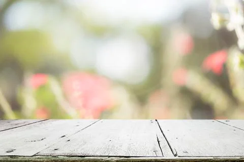 Selective focus empty wooden table on blured sweet pastel vintage bokeh backg Stock Photos