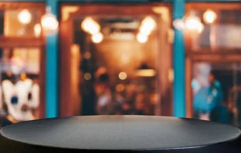 Selective Focus Empty wooden table in front of abstract blurred festive backg Stock Photos