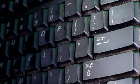 Selective focus on enter button of computer keyboard. Stock Photos