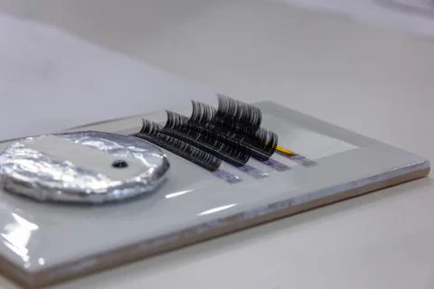 Selective focus Eyelash Extension tools on tile.Artificial lashes Stock Photos