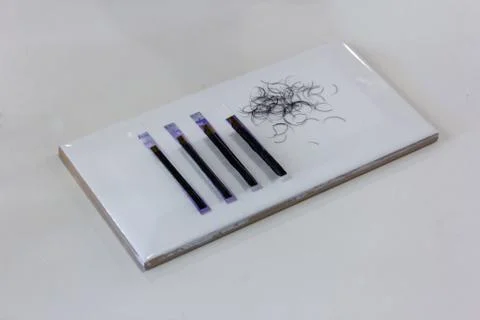 Selective focus Eyelash Extension tools on tile.Artificial lashes Stock Photos