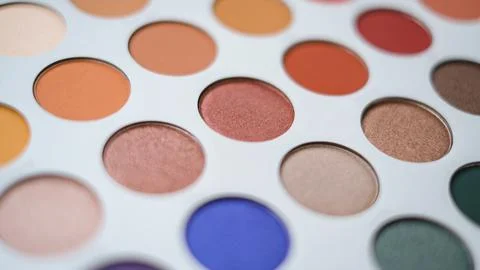 Selective focus of eyeshadow palette with various colors in pearly and matte Stock Photos